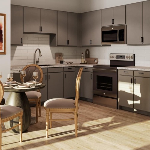 a kitchen with a table chairs and a refrigerator
