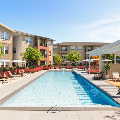 a swimming pool with seating areas