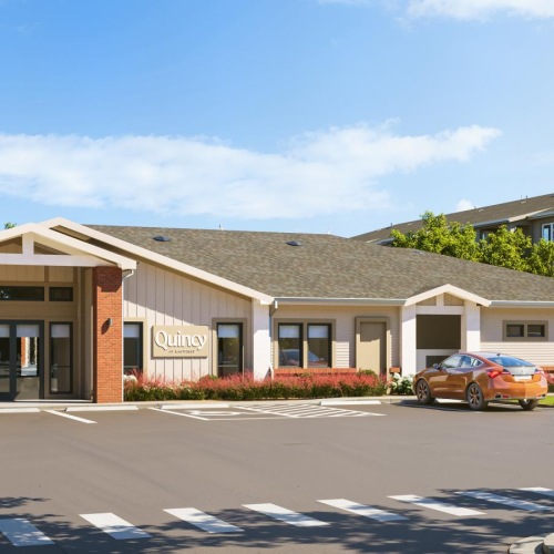 a building with cars parked in front