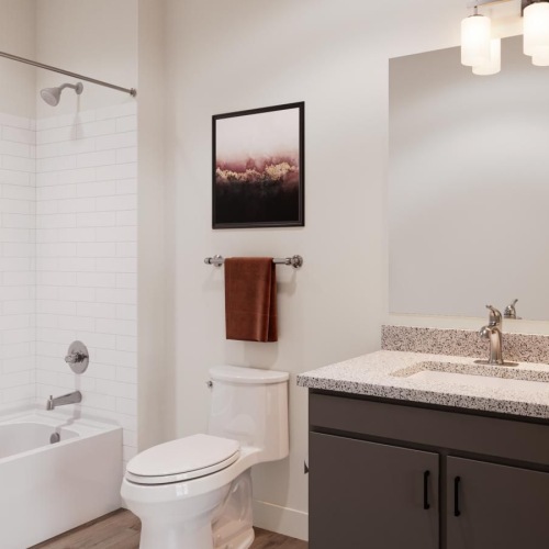 a bathroom with a tub sink and toilet